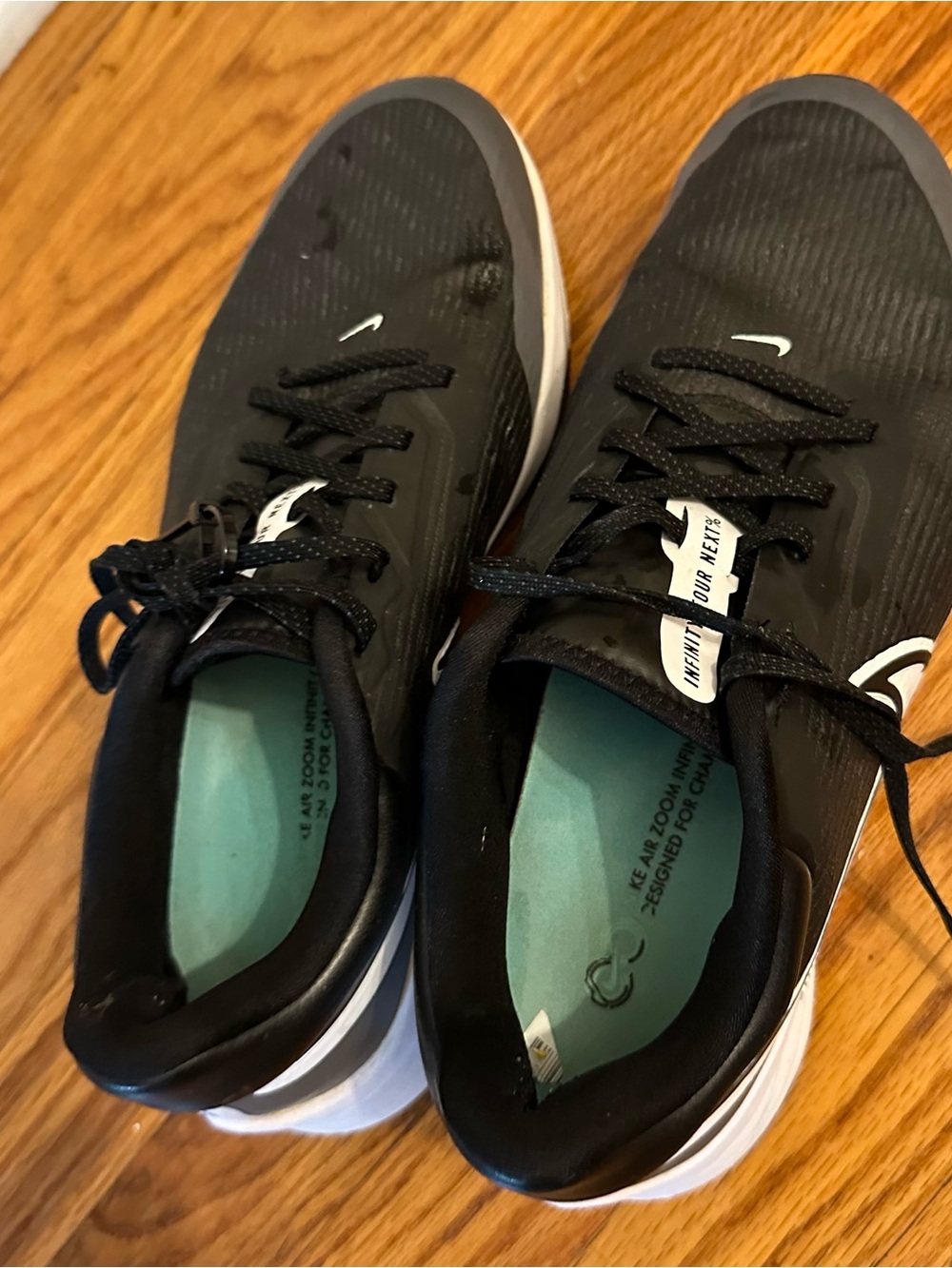 Nike Men’s Black Athletic Shoes with White Midsole and Teal Insole